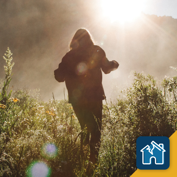 Lady hiking in the forest during sunrise